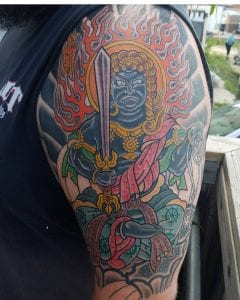 Tatuaje de Fudo Myoo en el brazo