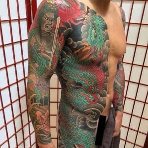 Tatuaje de manga Fudo Myoo en el brazo