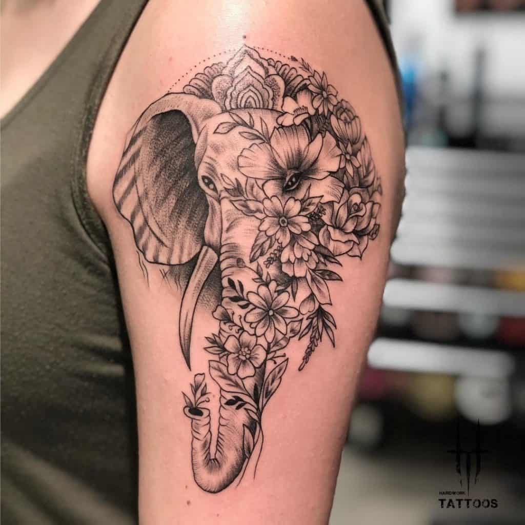 Diseño de tatuaje de elefante con flores 