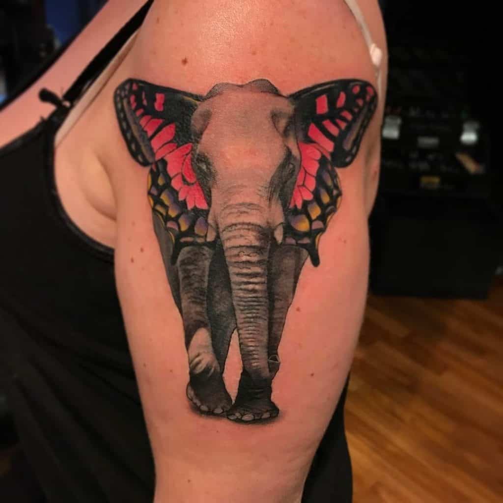 Diseño de tatuaje de elefante y mariposa