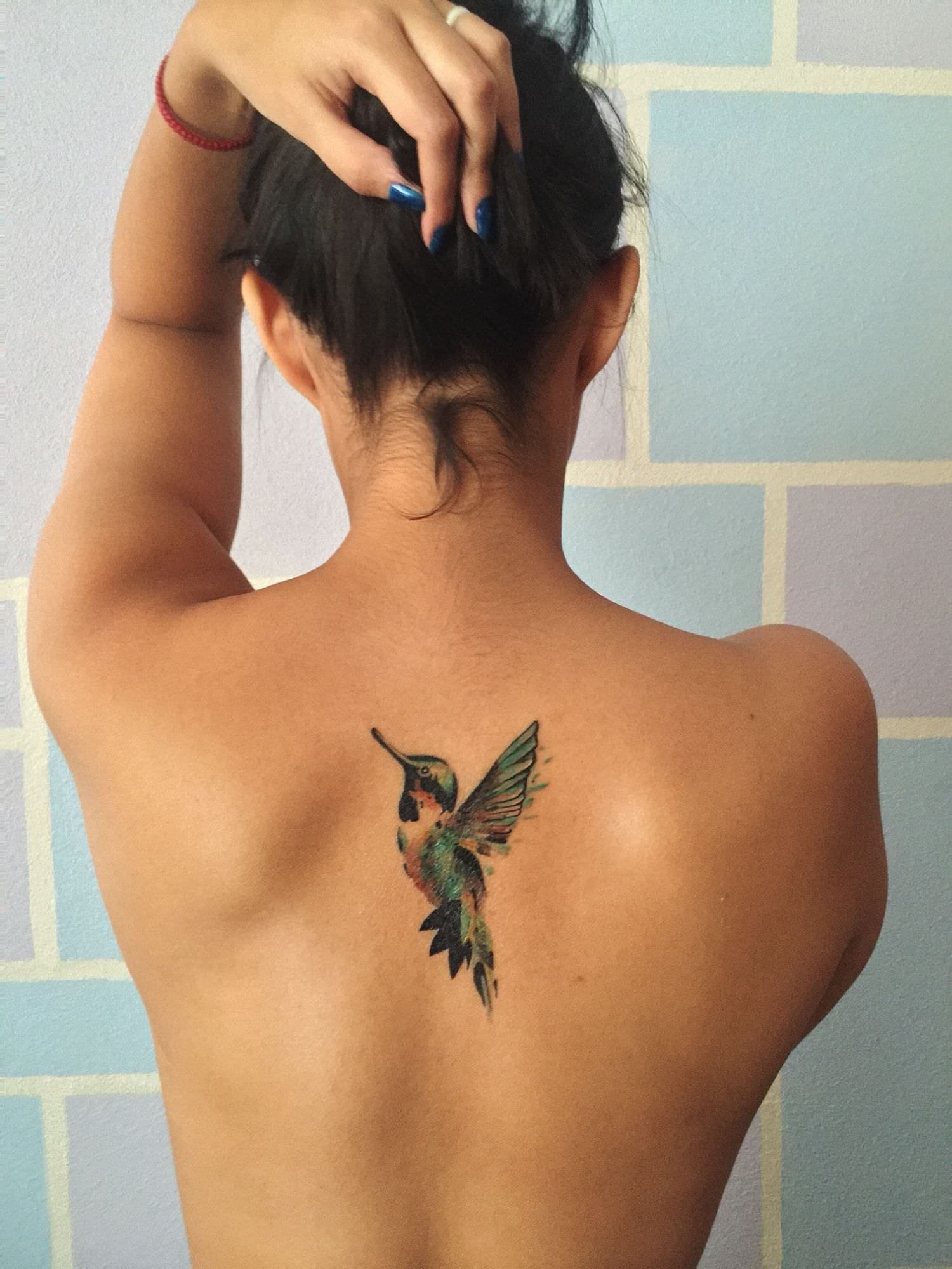 Tatuaje de colibrí melódico