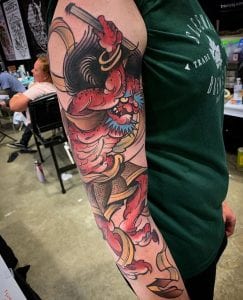 Tatuaje de raijin en el brazo