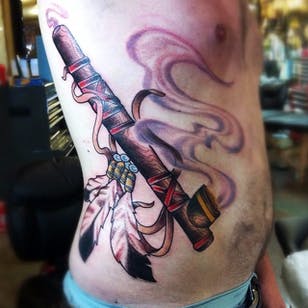 Peace Pipe Tattoo por Erik Kushner #peacepipe #pipe #smoke #feathers #NativeAmericaTattoo #traditional #ErikKushner