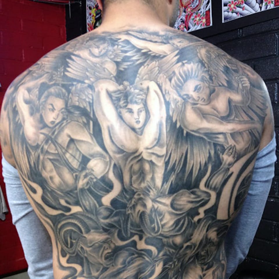 Tatuaje de Colin-Kaepernicks en la espalda