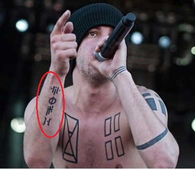 Tyler Joseph Right Forearm Symbols Tattoo.jpg