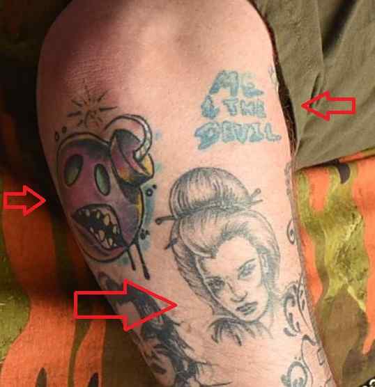 Tatuaje en el brazo, retrato de bomba con palabras de Rag N Bone Man